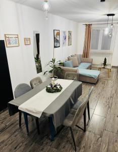 a living room with a table and a couch at Sielskie Apartamenty in Sandomierz