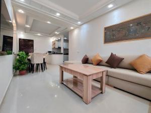 a living room with a couch and a table at Tangier Center Free Parking in Tangier