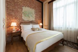 Cama o camas de una habitación en Hotel Pera Parma
