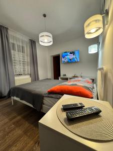 Posteľ alebo postele v izbe v ubytovaní Apartament Marcel