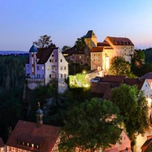 a group of buildings in a town at night at Ferienwohnung "EDDI" in Hohnstein