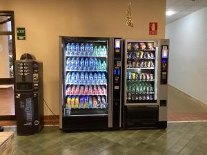 two soda machines in a store with drinks at Estupendo Estudio en Castle Harbour Los Cristianos in Los Cristianos