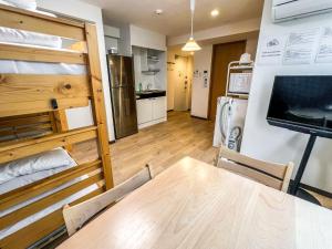 a kitchen and dining room with a table and chairs at Hostel In Kyoto Gion - Vacation STAY 13366v in Gionmachi