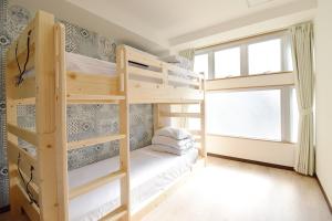 a bedroom with two bunk beds and a window at Hostel In Kyoto Gion - Vacation STAY 13354v in Gionmachi