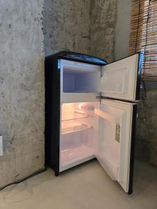 an empty refrigerator with its door open in a room at Mikasakan - Vacation STAY 18148 in Kinokawa