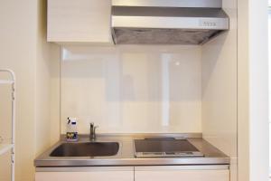 a kitchen with a sink and a counter top at Hostel In Kyoto Gion - Vacation STAY 13388v in Gionmachi