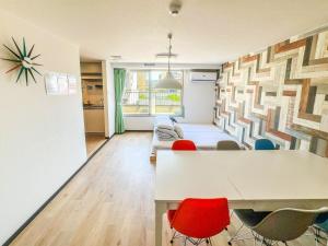 a living room with a table and chairs at Hostel In Kyoto Gion - Vacation STAY 13388v in Gionmachi +20 photos