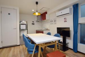 a kitchen and dining room with a table and chairs at Hostel In Kyoto Gion - Vacation STAY 13469v in Gionmachi +31 photos