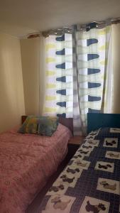 En eller flere senge i et værelse på apartamento playa 4 esquinas