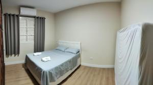 Postel nebo postele na pokoji v ubytování Casa Térrea 3 quartos, sendo 1 suíte Maringá