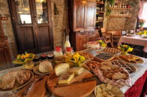 a table topped with lots of different types of food at Agriturismo del Cimone in Fanano