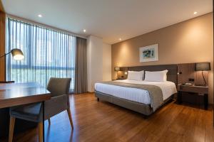 Postel nebo postele na pokoji v ubytování Estelar La Torre Suites + 30 fotografií