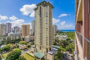 an aerial view of a tall building in a city at Royal Garden Waikiki - Ocean View - Resort Amenities in Honolulu
