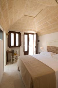 A bed or beds in a room at Antica Via Roma B&B E RELAX