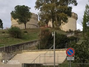 a street sign in front of two nuclear reactors at sotto il Castello in Matera
