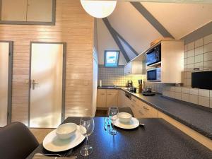 Kuchyň nebo kuchyňský kout v ubytování Ferienhaus-Helly-Natur-pur-mit-Seeblick + 18 fotografií