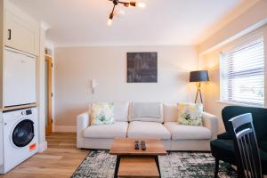 a living room with a couch and a table at Seanáras Beag in Galway +33 photos