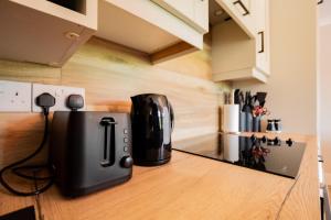 a coffee maker sitting on a counter in a kitchen at Seanáras Beag in Galway