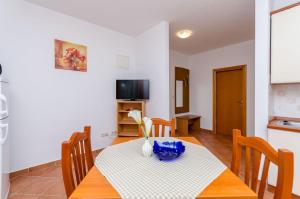 TV a/nebo společenská místnost v ubytování Apartments Palm tree