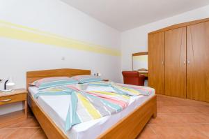 Postel nebo postele na pokoji v ubytování Apartments Palm tree