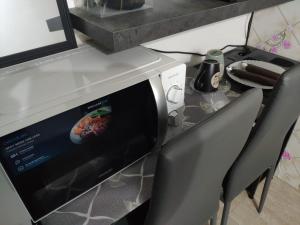 A television and/or entertainment centre at Mini Deluxe Room - Close to Metro C