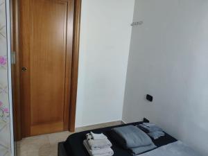 A bed or beds in a room at Mini Deluxe Room - Close to Metro C
