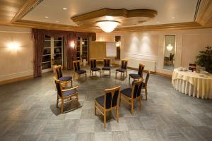 a large room with a table and chairs and a table and a table and chairs at Hotel Aselager Mühle in Herzlake +75 photos