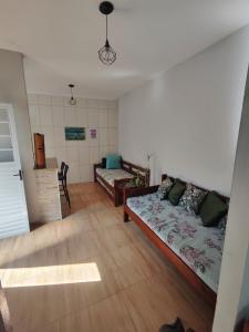 Postel nebo postele na pokoji v ubytování CasaUba - apartamento e kitnet