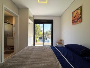 Ένα ή περισσότερα κρεβάτια σε δωμάτιο στο Casa Rubi C/ jacuzzi E Quiosque privativo na praia