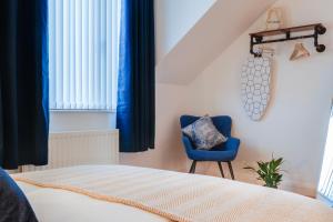 En eller flere senge i et værelse på Cherryville Street Apartment