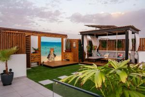a backyard with a gazebo and grass at Tropical Suite 22 A in Santa Maria