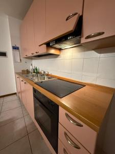 a kitchen with a sink and a stove at Il Raponzolo di Roccia in Monclassico +13 photos