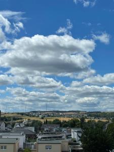 a sky filled with clouds over a city at Appartement Nr 32 in Mayen in Mayen