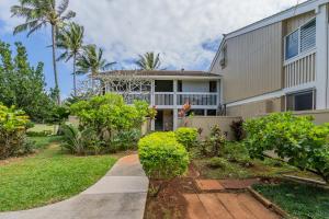 a house with a walkway in front of it at Makani Moana Loft - Golf Course View - North Shore - Sleeps 2 in Kahuku