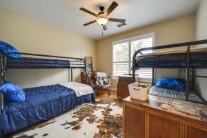a bedroom with two bunk beds and a ceiling fan at Family-Friendly Johnson City Home Near State Parks in Hye