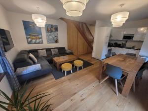an overhead view of a living room and dining room at Cham'Heart, 4-star apartments in Chamonix centre with free private parking in Chamonix-Mont-Blanc
