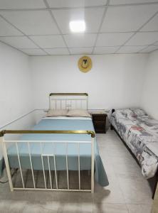 a bedroom with a bed in a room at Hospedaje Don Felix in General Acha