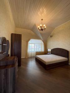 Una cama o camas en una habitación de Shamaxi Dacha