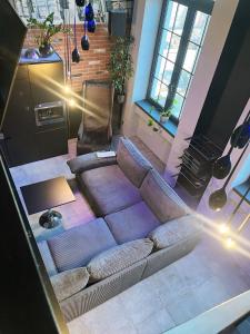 an overhead view of a living room with a couch at Loft Przędzalnia in Żyrardów