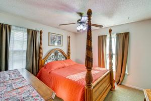 a bedroom with a bed and a ceiling fan at Near Fort Liberty Home with Yard in Fayetteville! in Fayetteville