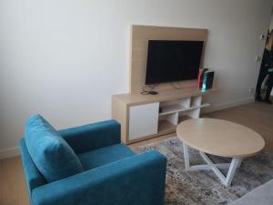 TV a/nebo společenská místnost v ubytování Zepterme 511