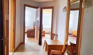 a living room with a table and a dining room at Hotel Boizenburger Hof in Boizenburg