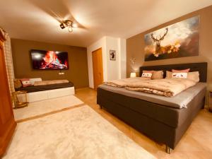 A bed or beds in a room at Sonnalm Panoramablick