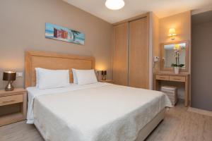 Postel nebo postele na pokoji v ubytování Mary's Residence Suites