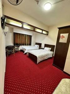 Postel nebo postele na pokoji v ubytování LA Luna Hotel DOWNTOWN