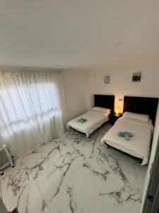 Postel nebo postele na pokoji v ubytování Palma Beach Apartment