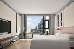 Ένα ή περισσότερα κρεβάτια σε δωμάτιο στο Four Points by Sheraton Datong Pingcheng +25 φωτογραφίες