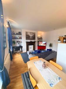 a living room with a table and a couch at Beautiful Apartment in Temple Bar in Dublin