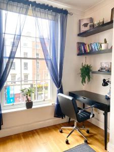 an office with a desk and a window at Beautiful Apartment in Temple Bar in Dublin