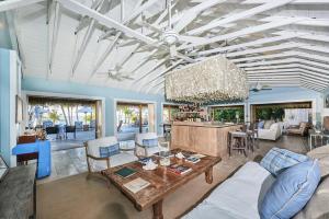 a living room with a couch and a table at Tiamo Resort in Kemps Bay